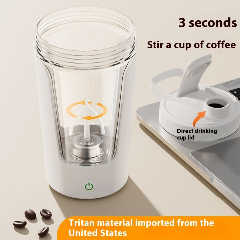 White electric rechargeable protein shaker clear cup and white base on a beige background
