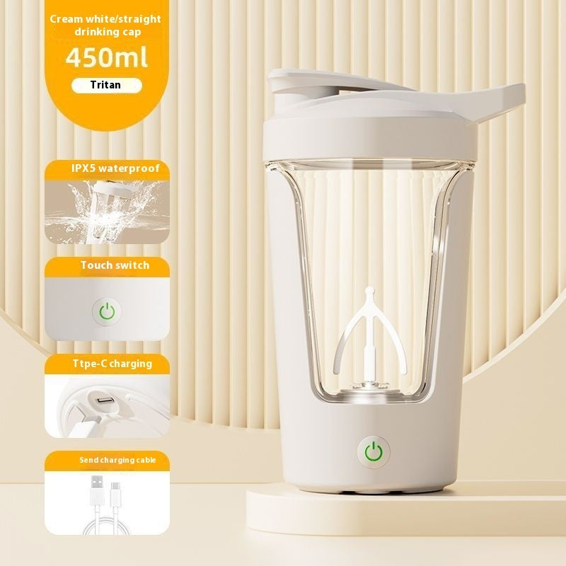 White rechargeable electric protein shaker with charging cable on a beige background